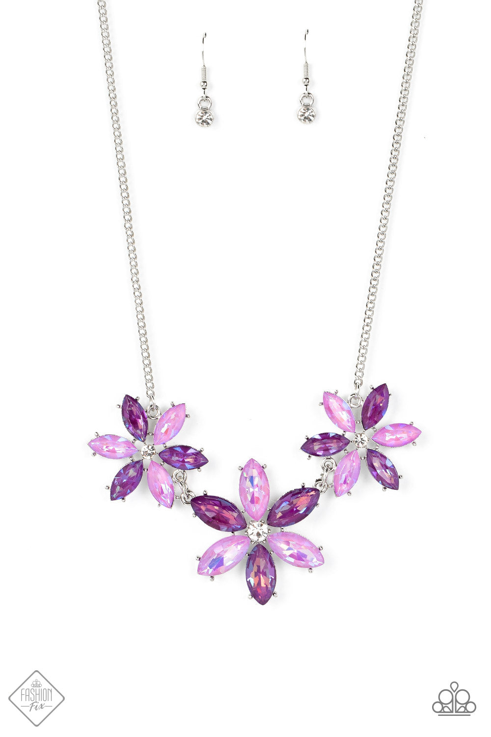 Dark and light purple marquise cut rhinestones gather into whimsical flowers dotted with brilliant white rhinestone centers. The sparkling purple gems are set in pronged settings and connect to a dainty silver chain creating a fanciful display across the collar. Features an adjustable clasp closure.  Sold as one individual necklace. Includes one pair of matching earrings.  New Kit Fashion Fix