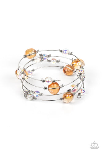 Glassy, orange and iridescent beads sporadically dot a strand of skinny wire, creating the illusion of floating spheres as they coil around the wrist in an infinity-wrap bracelet. One side of each marble-like bead is dipped in a silver coating, adding a hint of metallic shimmer to the abstract design, as rhinestone-encrusted accents add sparkling detail. Due to its prismatic palette, color may vary.
