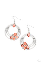 Load image into Gallery viewer, Glassy and opaque coral beads are strategically placed around rings of silver and accented white rhinestones to create a dreamy beach look. Earring attaches to a standard fishhook fitting.
