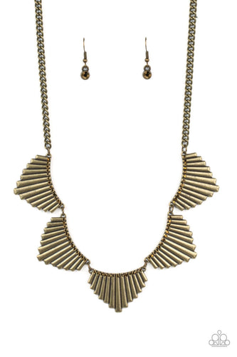 Crowned in glassy rows of sparkly topaz rhinestones, rectangular crimped brass frames fan out below the collar, creating a fierce metallic fringe. Features an adjustable clasp closure.
