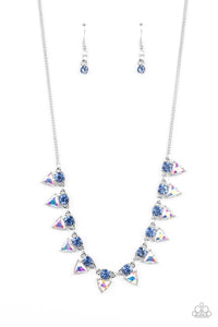 Solitaire blue rhinestones sparkle atop iridescent prism-like gems below the collar, linking into a sharp-looking statement piece. Features an adjustable clasp closure. Due to its prismatic palette, color may vary.