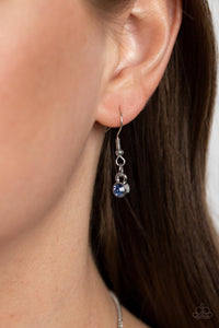 Solitaire blue rhinestones sparkle atop iridescent prism-like gems below the collar, linking into a sharp-looking statement piece. Features an adjustable clasp closure. Due to its prismatic palette, color may vary.