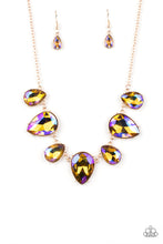 Load image into Gallery viewer, Featuring a stellar iridescence, an oversized collection of glittery iridescent teardrop gems alternates upside down and right-side-up below the collar for an out-of-this-world sparkle. Features an adjustable clasp closure. Due to its prismatic palette, color may vary. 
