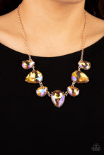 Load image into Gallery viewer, Featuring a stellar iridescence, an oversized collection of glittery iridescent teardrop gems alternates upside down and right-side-up below the collar for an out-of-this-world sparkle. Features an adjustable clasp closure. Due to its prismatic palette, color may vary. 
