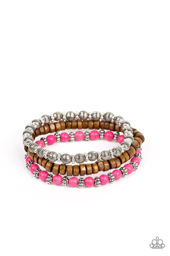 Vivacious pink stone beads, wooden beads, and silver antiqued beads are threaded along elastic stretchy bands. Sprinkled between the colorful beads are dainty silver-studded flower beads for a whimsical finish.