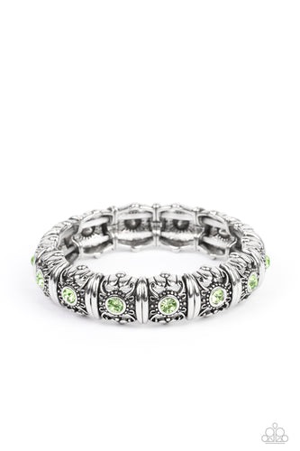 Centered around silver intricate, floral casings, green rhinestones glimmer on threaded stretchy bands around the wrist for an ageless look.