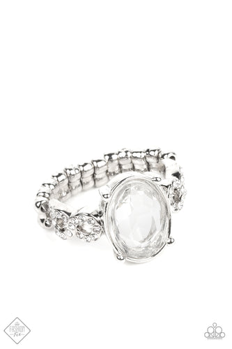 A translucent oval gem floats inside a silver frame with pronged settings. Dainty infinity symbols, encrusted in white rhinestones, sit on either side of the faceted clear gem, adding transcendent twinkle to the design. Features a dainty stretchy band for a flexible fit.  Sold as one individual ring.  New Kit Fashion Fix