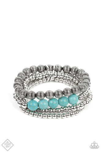 Strands of small silver beads polished in a high sheen finish stack together with a strand of silver beads etched in linear patterns. A row of turquoise stones pops against the backdrop of metallic shimmer, as the stretchy bands are bundled together by a pair of silver rings. As the stone elements in this piece are natural, some color variation is normal.  Sold as one set of four bracelets.