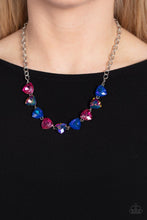 Load image into Gallery viewer, A collection of dreamy trilliant-cut rhinestones in iridescent shades of blue and pink fall in line along the collar in a majestic finish. Features an adjustable clasp closure. Due to its prismatic palette, color may vary.
