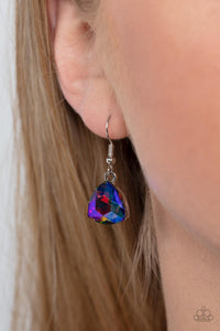 A collection of dreamy trilliant-cut rhinestones in iridescent shades of blue and pink fall in line along the collar in a majestic finish. Features an adjustable clasp closure. Due to its prismatic palette, color may vary.