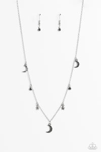 Dotted with dainty hematite rhinestones, a cosmic collection of silver moon and star charms swings from a dainty silver chain below the collar. Solitaire hematite rhinestones sparkle in between the charms, adding additional sparkle to the piece. Features an adjustable clasp closure. 