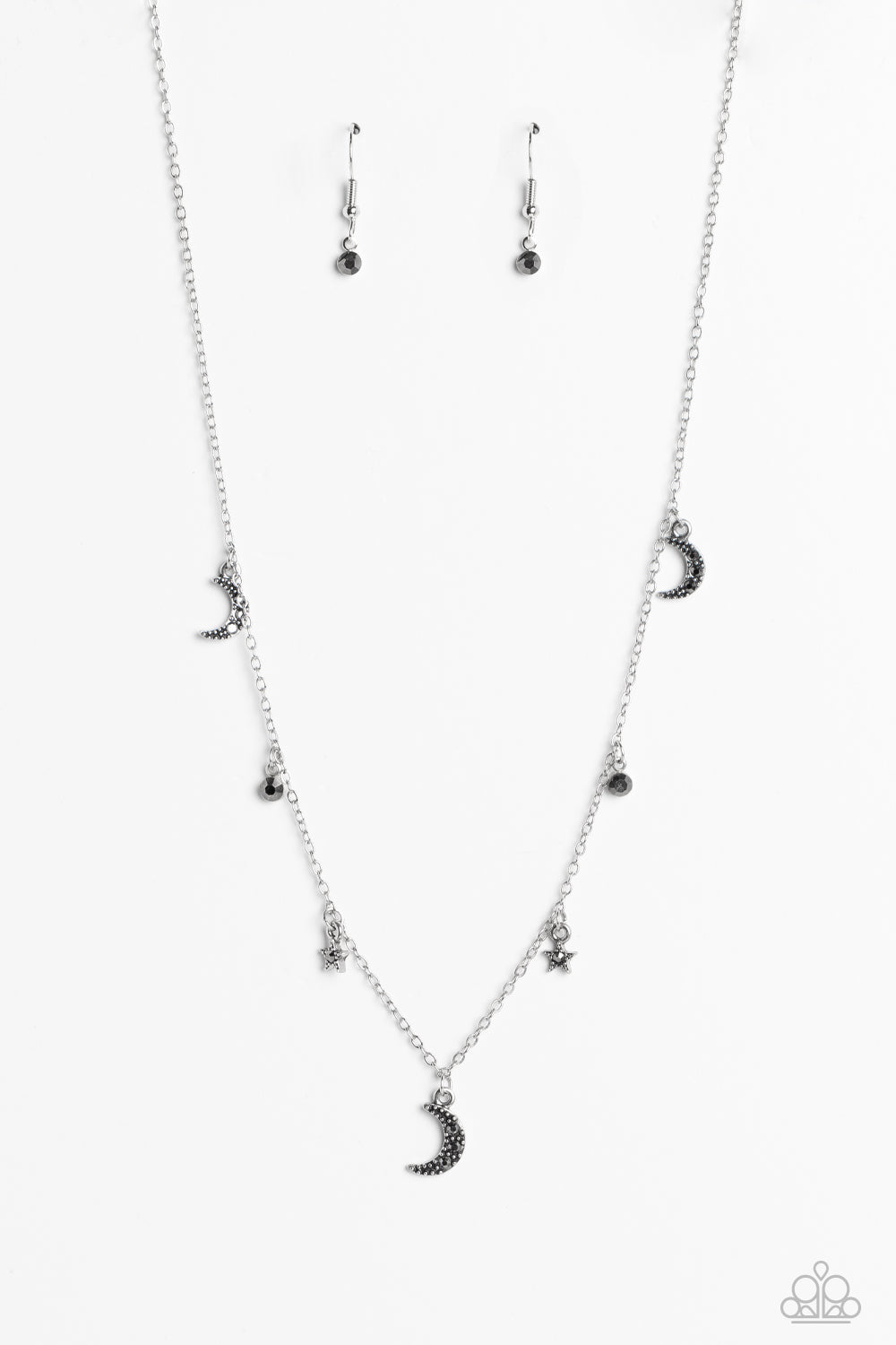 Dotted with dainty hematite rhinestones, a cosmic collection of silver moon and star charms swings from a dainty silver chain below the collar. Solitaire hematite rhinestones sparkle in between the charms, adding additional sparkle to the piece. Features an adjustable clasp closure. 