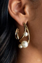 Load image into Gallery viewer, Two dainty gold bars curve into dazzling double hoops, creating asymmetrical framework. Varying sizes of classic pearls dot the edges of the classic hoops, creating the illusion of floating pearl accents. Earring attaches to a standard post fitting. Hoop measures approximately 1 1/2&quot; in diameter.  Sold as one pair of hoop earrings.
