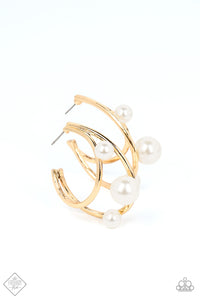 Two dainty gold bars curve into dazzling double hoops, creating asymmetrical framework. Varying sizes of classic pearls dot the edges of the classic hoops, creating the illusion of floating pearl accents. Earring attaches to a standard post fitting. Hoop measures approximately 1 1/2" in diameter.  Sold as one pair of hoop earrings.