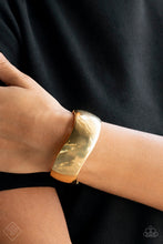 Load image into Gallery viewer, A thick band of gold wraps around the wrist in a dramatic display. As the edges of the band curve into subtle waves, the high sheen finish creates a blinding display of intense sheen that demands attention. Features a hinged closure.  Sold as one individual bracelet.
