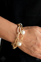 Load image into Gallery viewer, A strand of elongated, oversized gold links layers with a strand of identical links in a slightly smaller size as they wrap around the wrist. Three classic white pearls dot the strand of smaller links, adding a soft, refined contrast to the industrial chains. Features an adjustable clasp closure.  Sold as one individual bracelet.
