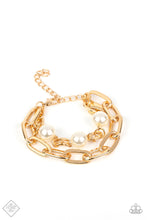 Load image into Gallery viewer, A strand of elongated, oversized gold links layers with a strand of identical links in a slightly smaller size as they wrap around the wrist. Three classic white pearls dot the strand of smaller links, adding a soft, refined contrast to the industrial chains. Features an adjustable clasp closure.  Sold as one individual bracelet.
