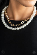 Load image into Gallery viewer, A string of classic white pearls is layered with a strand of oversized gold links, creating a gorgeous collision of refinement and grit as they lay along the collar. Features an adjustable clasp closure.  Sold as one individual necklace. Includes one pair of matching earrings.
