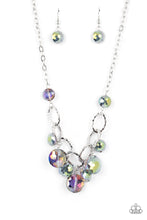 Load image into Gallery viewer, A collection of round, glassy purple-shaded beads in varying sizes swirl around shiny silver oval links hammered in texture. The beveled shape and faceted surfaces of the beads are brushed in a subtle oil-spill glaze, creating a dreamy display as they drip below the collar. Features an adjustable clasp closure. Due to its prismatic palette, color may vary. 
