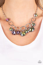 Load image into Gallery viewer, A collection of round, glassy purple-shaded beads in varying sizes swirl around shiny silver oval links hammered in texture. The beveled shape and faceted surfaces of the beads are brushed in a subtle oil-spill glaze, creating a dreamy display as they drip below the collar. Features an adjustable clasp closure. Due to its prismatic palette, color may vary. 
