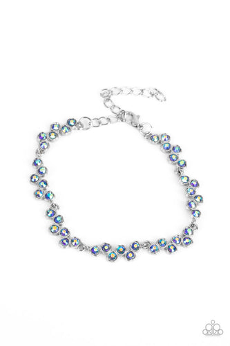 Set in dainty silver heart-shaped frames, staggered clusters of glassy sapphire rhinestones delicately link into a flirtatious hint of sparkle around the wrist. Features an adjustable clasp closure. Due to its prismatic palette, color may vary.