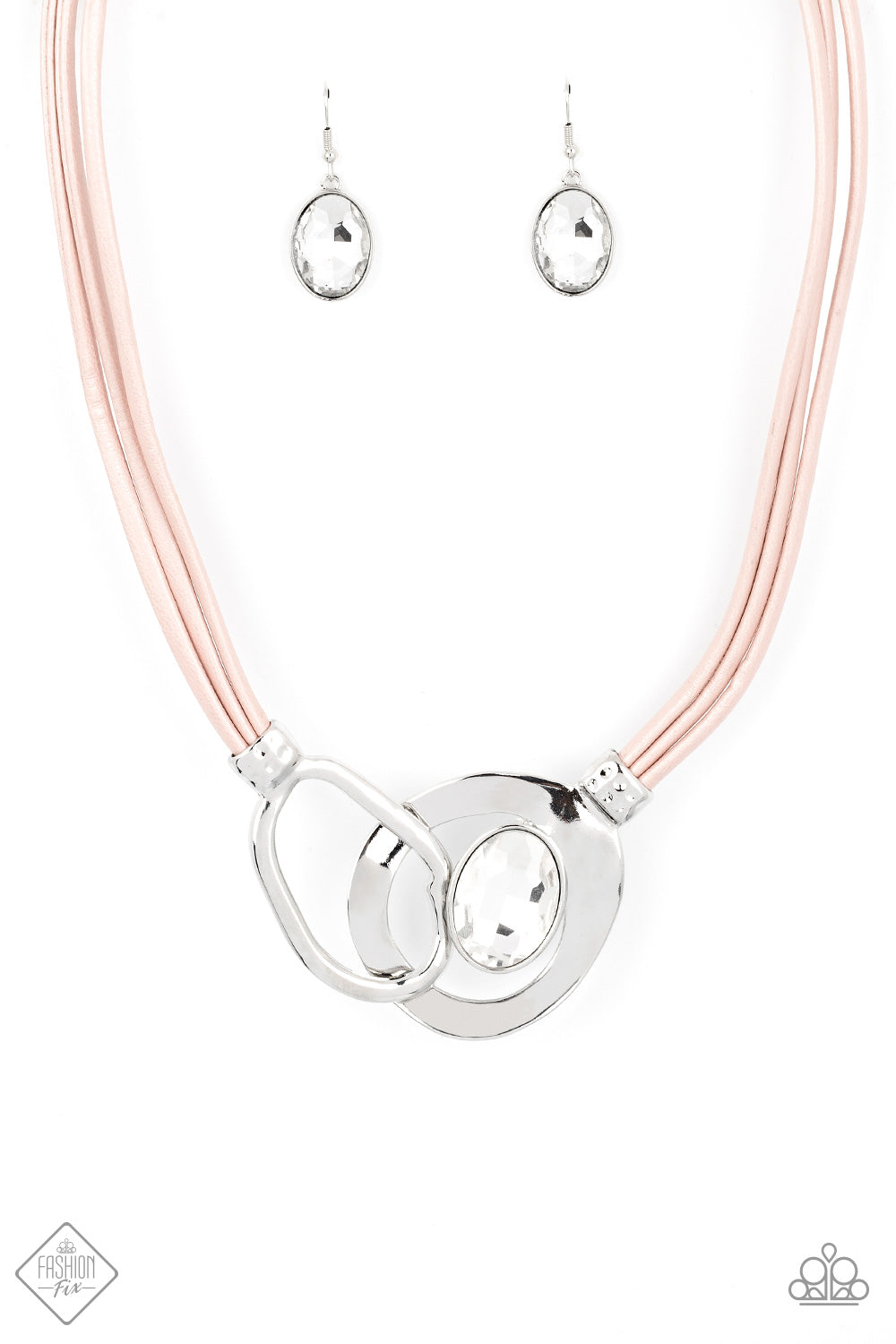 Attached to shimmery strands of pink leather, a pair of oversized and warped silver links delicately overlaps into a contemporary centerpiece below the collar. An exaggerated white gem asymmetrically embellishes the silvery accent piece, adding unexpected elegance to the modern design. Features an adjustable clasp closure.  Sold as one individual necklace. Includes one pair of matching earrings.  New Kit Fashion Fix