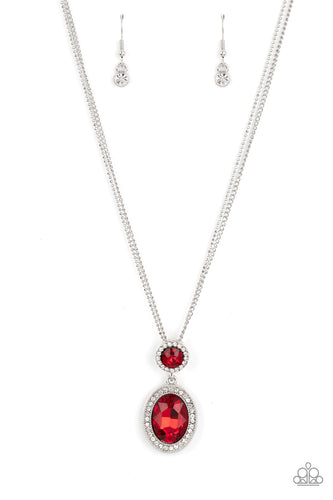 A large oval red rhinestone is encased in a border of rhinestone-dusted silver, as it's suspended from a smaller version of the same design. The stacked pendant then slides along a pair of silver chains in a regal finish. Features an adjustable clasp closure. 