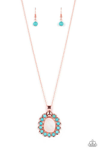 Dangling from a shiny copper chain, an asymmetrical white shell with an opal finish is encircled by a turquoise stone-studded frame, creating a seasonal Southwestern pattern. As the stone elements in this piece are natural, some color variation is normal. Features an adjustable clasp closure.