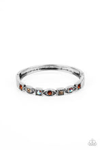 Load image into Gallery viewer, A collection of square and marquise-shaped frames arc across the wrist in a stunning geometric display. Tea, light topaz, and iridescent rhinestones are pressed into the centers of the thick silver frames, adding irresistible sparkle to the bangle-inspired design. Features a hinged closure. Due to its prismatic palette, color may vary. 
