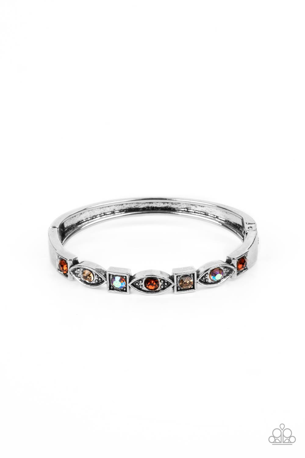 A collection of square and marquise-shaped frames arc across the wrist in a stunning geometric display. Tea, light topaz, and iridescent rhinestones are pressed into the centers of the thick silver frames, adding irresistible sparkle to the bangle-inspired design. Features a hinged closure. Due to its prismatic palette, color may vary. 