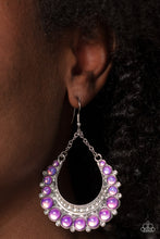 Load image into Gallery viewer, Bubbly purple beads are wrapped in silver frames as they fan out into a dramatic horseshoe shape. A thick silver crescent lined with white rhinestones nestles along the inside of the curve at the bottom, as tiny white rhinestones peek out from below the glassy purple beads. The dramatic design is suspended from silver chains, allowing the fancy framework to sway freely. Earring attaches to a standard fishhook fitting. 
