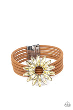 Load image into Gallery viewer, Row after row of brown suede cords layer around the wrist. Featuring oblong marquise style cuts, a collection of yellow and iridescent rhinestones fans out into a circular focal point, resulting in a celestial centerpiece. Features a magnetic closure. Due to its prismatic palette, color may vary. 
