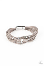 Load image into Gallery viewer, Row after row of gray suede cords layer around the wrist. Varying sizes of shiny silver studs coalesce across the cords in an out-of-this-world pattern for a starry statement. Features a magnetic closure.  Sold as one individual bracelet
