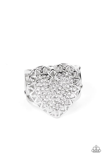 An airy silver frame with cutouts resembling a subtle zig-zag pattern, wraps around a heart filled with brilliant white rhinestones to create a dazzling centerpiece atop the finger. Features a stretchy band for a flexible fit. 