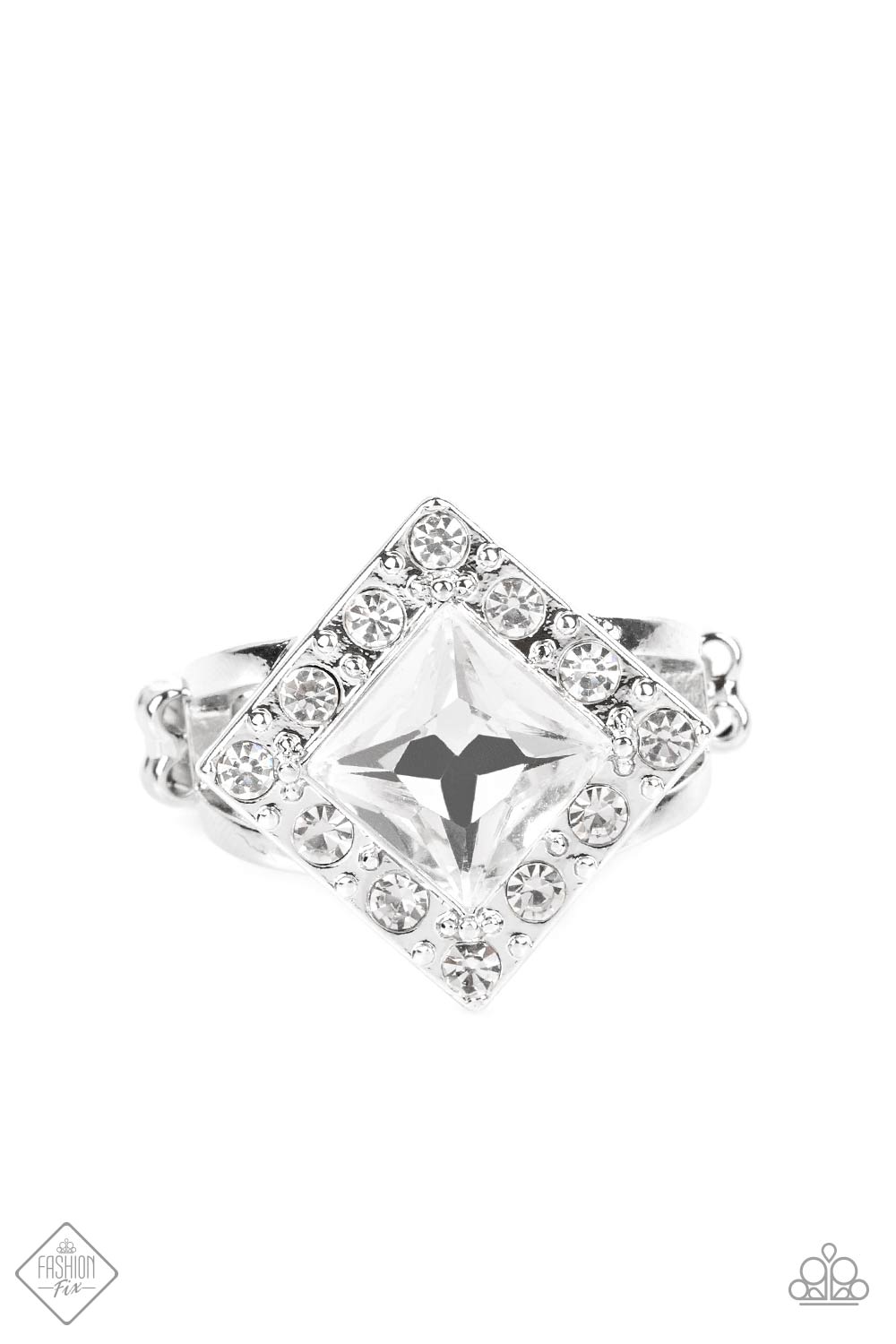 An oversized, square-cut, white rhinestone is tilted on a point and framed by tiny white gems. As it sits atop a pair of sleek silver bands, the faceted surface of the centerpiece catches and reflects the light of the accents that surround it, magnifying its impressive impact. Features a dainty stretchy band for a flexible fit.  Sold as one individual ring.