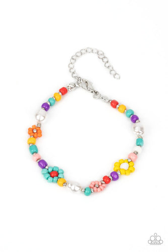 Modeled after gerber daisies, multicolored seed beed petals in shades of Tiffany, orange, pink, and yellow bloom around white, red, and silver beaded centers resulting in a dazzling collection of florals around the wrist. Varying sizes of beads in the same shades, along with a couple of small baroque pearls, separate the floral designs in a far-out finish. Features an adjustable clasp closure. 