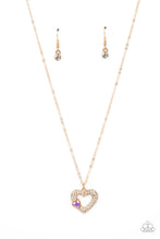 Load image into Gallery viewer, A luxurious airy gold heart lush with glassy white rhinestones swings from a classic gold chain. A faceted heart gem brushed in an iridescent shimmer graces one side of the larger bedazzled heart for a romantic finish. Features an adjustable clasp closure. Due to its prismatic palette, color may vary. 
