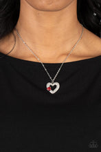 Load image into Gallery viewer, A luxurious airy silver heart lush with glassy white rhinestones swings from a classic silver chain. A faceted heart gem brushed in a red shimmer graces one side of the larger bedazzled heart for a romantic finish. Features an adjustable clasp closure. 
