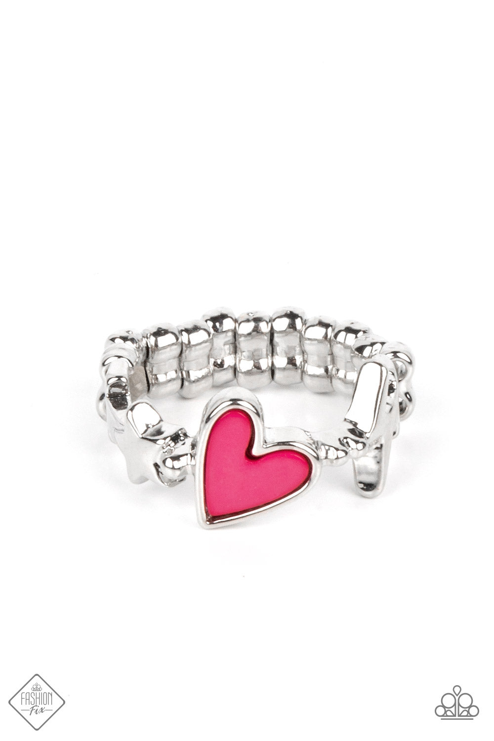A small pink heart is wrapped in a thick silver frame and nestled between a tiny lightning bolt and star on a skinny silver band that arcs across the finger. Features a dainty stretchy band for a flexible fit.  Sold as one individual ring.