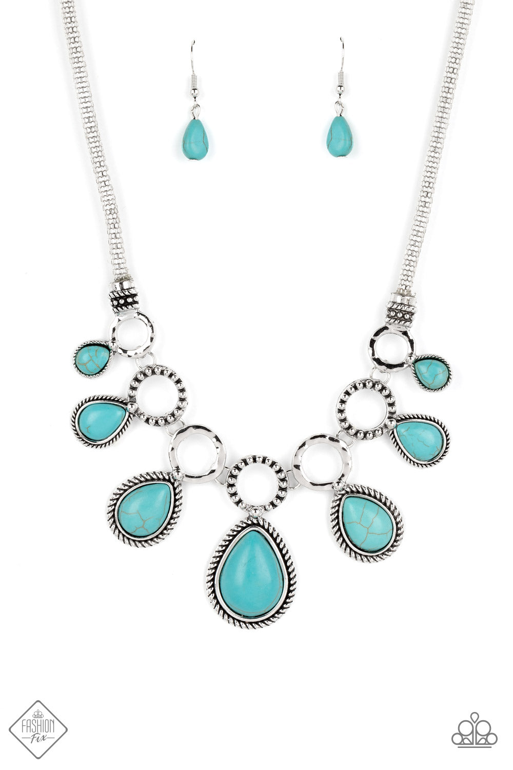 An airy mesh chain gives way to a collection of silver rings that link along the collar. A rustic dot motif decorates three of the rings, alternating with the remaining hoops that feature a subtle hammered texture. A polished turquoise stone teardrop falls from each silver hoop, graduating in size as they lead to the center. Features an adjustable clasp closure. As the stone elements in this piece are natural, some color variation is normal.