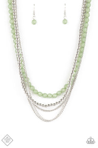 Shiny silver beads fall together with classic silver chains to create shimmery layers along the collar. A strand of opaque, faceted beads, in the calming shade of Loden Frost, emerges from the backdrop of metallic sheen, adding a subtle pop of color to the invigorating design. Features an adjustable clasp closure.  Sold as one individual necklace. Includes one pair of matching earrings.