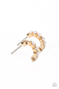 Tiny, white, opalescent beads are encased in gold fittings, falling in line as they curve into a dainty hoop. The gold frames create a scalloped pattern along the sides of the hoop, while the opalescent beading radiates shimmer from the front. Earring attaches to a standard post fitting. Hoop measures approximately 1/4" in diameter.