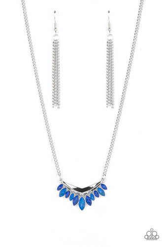 Hanging from a classic silver chain, varying shades of blue marquise-cut gems, encased in sleek silver frames, line the edge of a daring V-shaped bar for a boisterous fringe. Features an adjustable clasp closure.