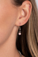 Load image into Gallery viewer, Encased in shimmery silver frames, a collection of pink, opalescent, teardrop gems twinkles above the collar. Dainty pink pearls, pink crystal-like gems, and rhinestones in an iridescent finish surround each teardrop, amplifying their dreamy disposition as the clusters connect to a classic silver chain. Features an adjustable clasp closure. Due to its prismatic palette, color may vary.  Sold as one individual necklace. Includes one pair of matching earrings.
