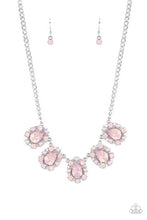 Load image into Gallery viewer, Encased in shimmery silver frames, a collection of pink, opalescent, teardrop gems twinkles above the collar. Dainty pink pearls, pink crystal-like gems, and rhinestones in an iridescent finish surround each teardrop, amplifying their dreamy disposition as the clusters connect to a classic silver chain. Features an adjustable clasp closure. Due to its prismatic palette, color may vary.  Sold as one individual necklace. Includes one pair of matching earrings.
