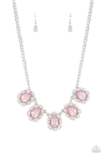 Encased in shimmery silver frames, a collection of pink, opalescent, teardrop gems twinkles above the collar. Dainty pink pearls, pink crystal-like gems, and rhinestones in an iridescent finish surround each teardrop, amplifying their dreamy disposition as the clusters connect to a classic silver chain. Features an adjustable clasp closure. Due to its prismatic palette, color may vary.  Sold as one individual necklace. Includes one pair of matching earrings.