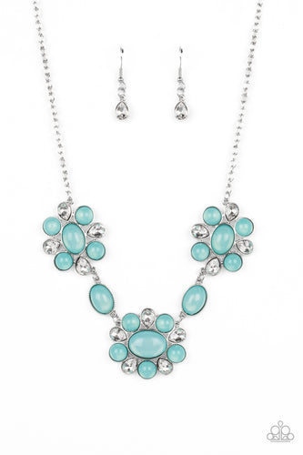 Brilliant, white, teardrop-shaped rhinestones, set in silver fittings,  are set between glassy opalescent beads in the tranquil shade of Waterspout, wrapping around an oval bead in the same blue tint to create three floral-inspired clusters. Polished oval beads featuring the same dreamy opalescence are placed in between the clusters, segueing to the largest one that emerges as a fantastic focal point. Features an adjustable clasp closure.