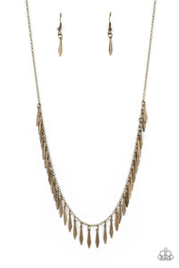 Dainty brass bars with a subtle curvature along their center, dance vivaciously along a brass chain to create a fierce fringe along the neckline. Each brass bar is flared at the bottom, expanding its light-catching surface to exaggerate the gleam that radiates from this monochromatic mashup. Features an adjustable clasp closure. 