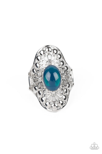 A glassy, Midnight, oval bead is pressed into a shimmery frame swirling with silver floral filigree, creating a whimsical centerpiece atop the finger. Features a stretchy band for a flexible fit. 