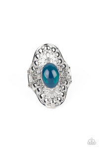 A glassy, Midnight, oval bead is pressed into a shimmery frame swirling with silver floral filigree, creating a whimsical centerpiece atop the finger. Features a stretchy band for a flexible fit. 